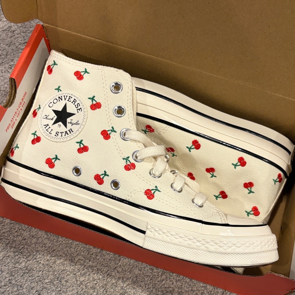 BNIB cherry high top converse.
